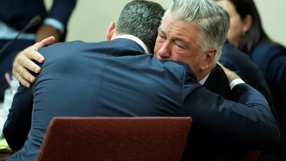 US actor Alec Baldwin hugs his attorney Alex Spiro at the conclusion of Baldwin's trial on involuntary manslaughter at Santa Fe County District Court in Santa Fe, New Mexico, on July 12, 2024. Baldwin's trial for involuntary manslaughter was dismissed by a judge Friday after she ruled that key evidence over a fatal shooting on the set of "Rust" had been withheld from the defense.   RAMSAY DE GIVE/Pool via REUTERS