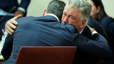 US actor Alec Baldwin hugs his attorney Alex Spiro at the conclusion of Baldwin's trial on involuntary manslaughter at Santa Fe County District Court in Santa Fe, New Mexico, on July 12, 2024. Baldwin's trial for involuntary manslaughter was dismissed by a judge Friday after she ruled that key evidence over a fatal shooting on the set of "Rust" had been withheld from the defense.   RAMSAY DE GIVE/Pool via REUTERS