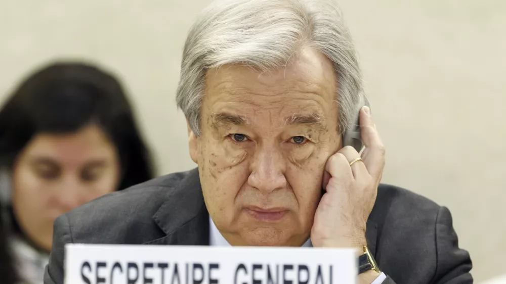 FILE - U.N. Secretary-General Antonio Guterres listens to a speech during the opening of the High-Level Segment of the 55th session of the Human Rights Council at the European headquarters of the United Nations in Geneva, Switzerland, on Feb. 26, 2024. Guterres appealed for funding Friday, July 13, 2024, for the beleaguered U.N. agency helping Palestinian refugees in Gaza and elsewhere in the Middle East, accusing Israel of issuing evacuation orders that force Palestinians "to move like human pinballs across a landscape of destruction and death."(Salvatore Di Nolfi/Keystone via AP, File)