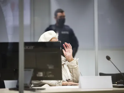 Irmgard Furchner, accused of being part of the apparatus that helped the Nazis' Stutthof concentration camp function, arrives at the court for the verdict in her trial in Itzehoe, Germay, Tuesday, Dec. 20, 2022. The German court convicted the 97-year-old woman of being an accessory to murder for her role as a secretary to the SS commander of the Nazis' Stutthof concentration camp during World War II. <br>(Christian Charisius/Pool Photo via DPA)