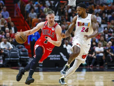 Dec 20, 2022; Miami, Florida, USA; Chicago Bulls guard Goran Dragic (7) dribbles the basketball as Miami Heat forward Haywood Highsmith (24) defends during the second quarter at FTX Arena. Mandatory Credit: Sam Navarro-USA TODAY Sports