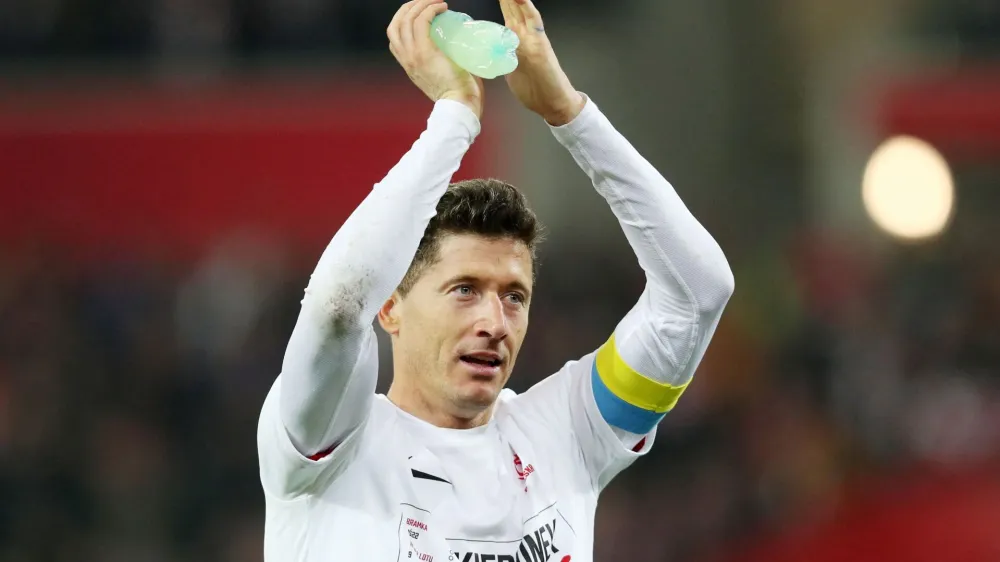 FILE PHOTO: Soccer Football - World Cup - UEFA Qualifiers - Path B Playoff Final - Poland v Sweden - Silesian Stadium, Chorzow, Poland - March 29, 2022 Poland's Robert Lewandowski celebrates after qualifying for the World Cup Qatar 2022 REUTERS/Kacper Pempel/File Photo