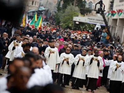 The Latin Patriarch of Jerusalem, Pierbattista Pizzaballa, attends Christmas celebrations, in Bethlehem, in the Israeli-occupied West Bank December 24, 2022. REUTERS/Mohamad Torokman