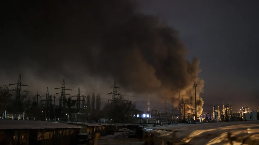 Smoke billows from a power infrastructure following a Russian drone attack in Kyiv region, Ukraine, Monday, Dec. 19, 2022. In recent months, Russia began targeting the energy infrastructure aiming to cut electricity and heating to Ukrainians, as the freezing winter advances. (AP Photo/Felipe Dana)