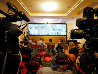 Journalists gather in front of a screen in a room of Russia's Supreme Court before a hearing on whether to designate Ukraine's Azov Regiment as a terrorist entity in Moscow, Russia August 2, 2022. REUTERS/Maxim Shemetov