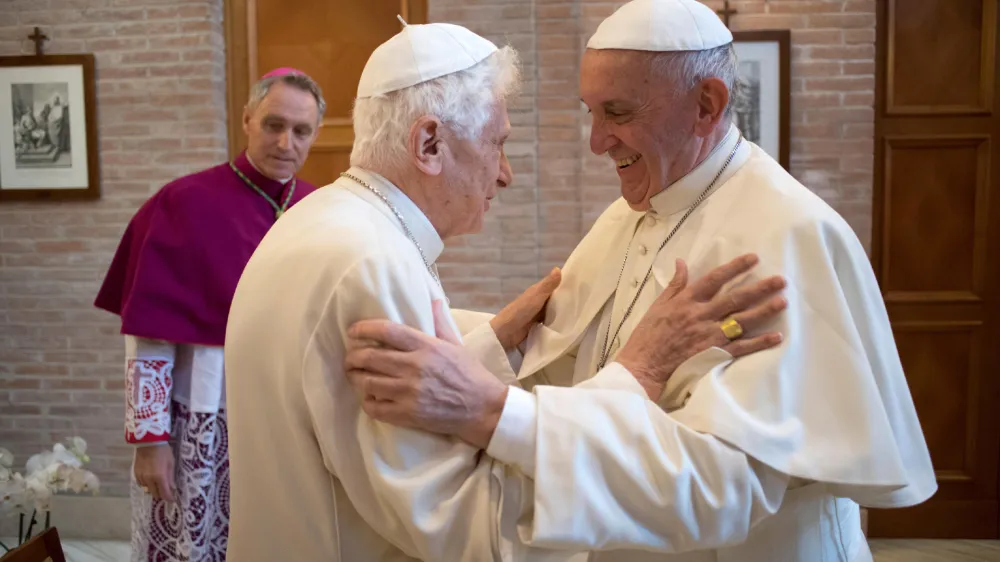 FILE - Pope Francis, right, hugs Pope Emeritus Benedict XVI in the former Convent Mater Ecclesiae at the Vatican, on Nov. 19, 2016. Pope Benedict XVI's 2013 resignation sparked calls for rules and regulations for future retired popes to avoid the kind of confusion that ensued. Benedict, the German theologian who will be remembered as the first pope in 600 years to resign, has died, the Vatican announced Saturday Dec. 31, 2022. He was 95. (L'Osservatore Romano/Pool Photo via AP, File)