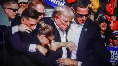 SCREENSHOT - 14 July 2024, US, Butler: Former US President Donald Trump is rushed off stage by secret service after being struck by gunfire during his Presidential Election campaign rally in Butler Pennsylvania. Photo: Artem Priakhin/SOPA Images via ZUMA Press Wire/dpa