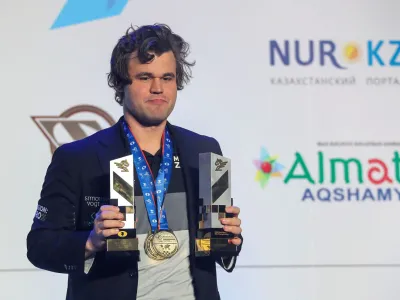 Chess - FIDE World Rapid and Blitz Championships 2022 - Award Ceremony - Almaty, Kazakhstan - December 30, 2022. World Rapid and Blitz Champion Magnus Carlsen of Norway holds his trophies. REUTERS/Pavel Mikheyev