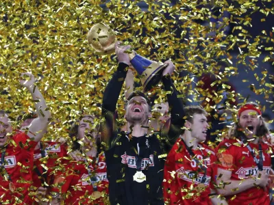 ﻿Handball - 2021 IHF Handball World Championship - Gold Medal Match - Denmark v Sweden - Cairo Stadium Hall 1, Cairo, Egypt - January 31, 2021 Denmark's Niklas Landin Jacobsen lifts the trophy as they celebrate after winning the Gold Medal Match REUTERS/Mohamed Abd El Ghany