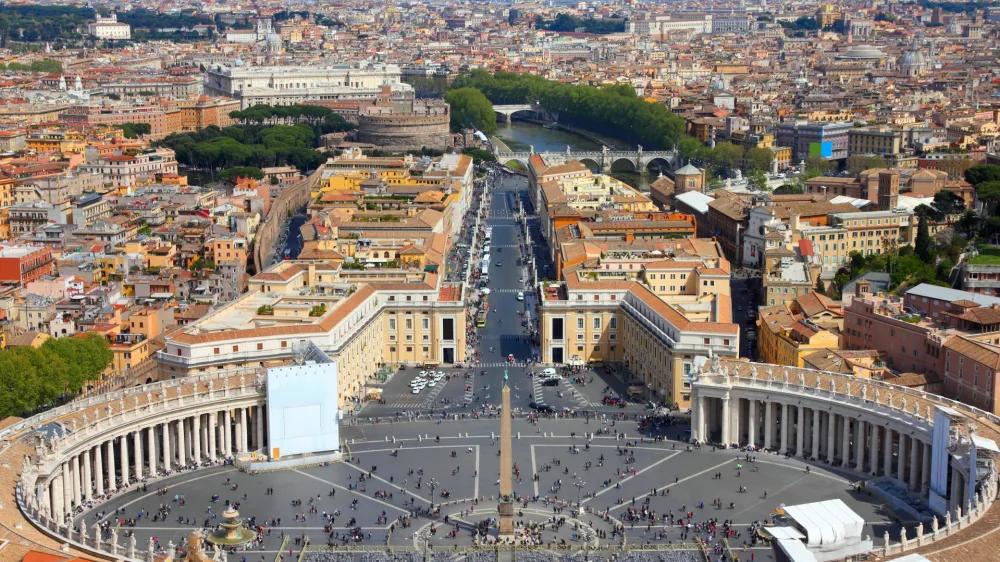 Rome, Italy. Famous Saint Peter's Square in Vatican and aerial view of the city. UNESCO World Heritage Site.