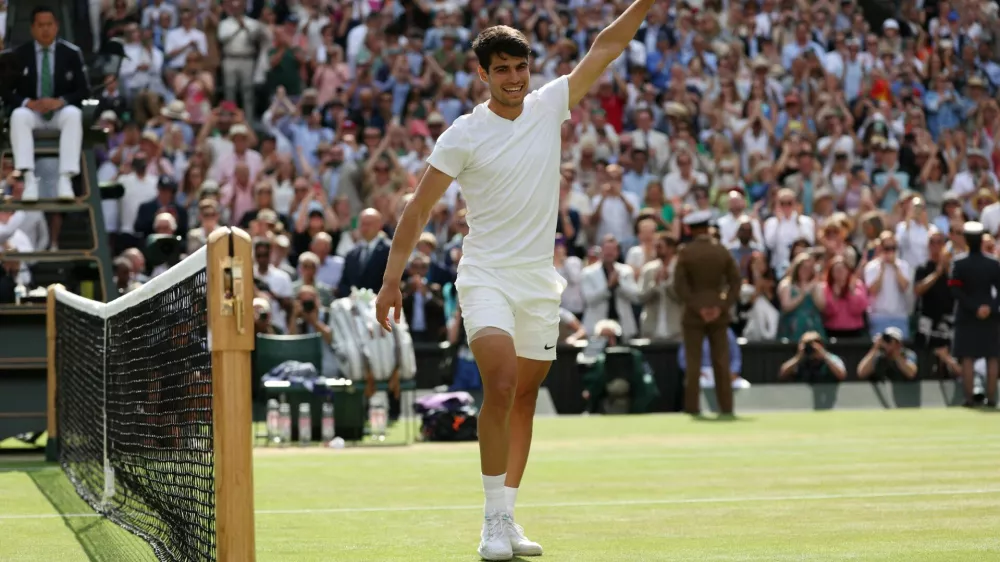 Tennis - Wimbledon - All England Lawn Tennis and Croquet Club, London, Britain - July 14, 2024 Spain's Carlos Alcaraz celebrates after winning the men's singles final against Serbia's Novak Djokovic REUTERS/Paul Childs