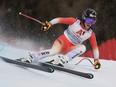 Switzerland's Lara Gut Behrami speeds down the course during an alpine ski, women's World Cup super-G, in St. Anton, Austria, Sunday, Jan.15, 2023. (AP Photo/Giovanni Maria Pizzato)