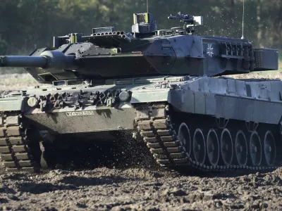 FILE - A Leopard 2 tank is pictured during a demonstration event held for the media by the German Bundeswehr in Munster near Hannover, Germany, Wednesday, Sept. 28, 2011. Germany faces mounting pressure to supply battle tanks to Kyiv and Ukrainian President Volodymyr Zelenskyy is airing frustration about not obtaining enough weaponry as Western allies confer on how best to support Ukraine nearly 11 months into Russia's invasion. Germany's new defense minister welcomed U.S. Defense Secretary Lloyd Austin to Berlin, declaring that German weapons systems delivered so far have proven their worth and that aid will continue in the future. (AP Photo/Michael Sohn, File)