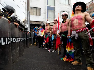 20 January 2023, Peru, Arequipa: Anti-government protesters stand in front of anti-riot police during a protest demanding immediate elections, the resignation of President Boluarte, the release of ousted President Castillo, and justice for protesters killed in clashes with police. Photo: Lucas Aguayo Araos/dpa