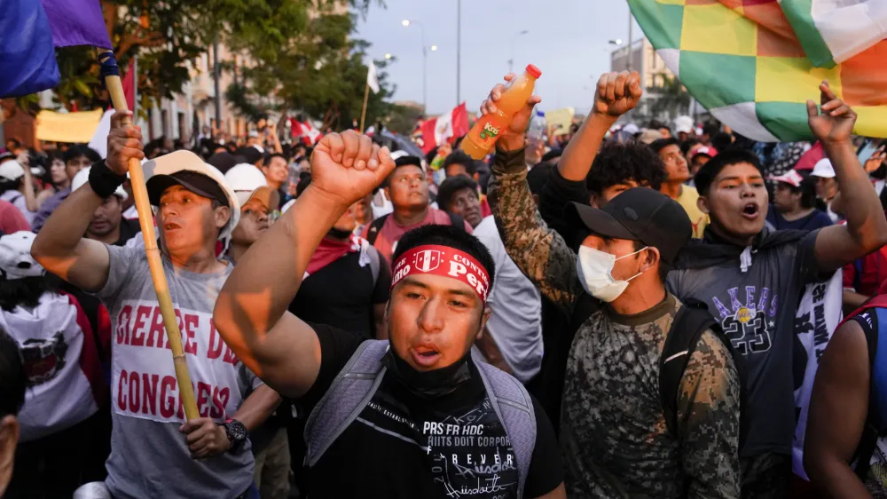 Anti-government protesters march in Lima, Peru, Saturday, Jan. 21, 2023. Protesters are seeking the resignation of President Dina Boluarte, the release from prison of ousted President Pedro Castillo and immediate elections. (AP Photo/Martin Mejia)