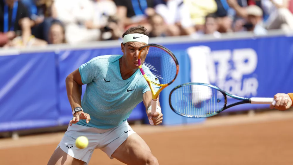 Spain's Rafael Nadal, left, and Norway's Casper Ruud's play a shot during the round of 16 double match against Mexico's Miguel Angel Reyes-Varela Martinez and Argentina's Guido Andreozzi at the Nordea Open ATP in Bastad, Sweden, Monday, July 15, 2024. (Adam Ihse/TT News Agency via AP)