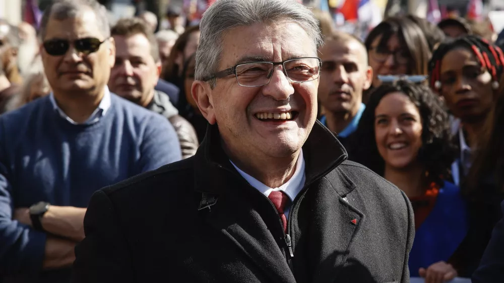 French far-left candidate for the upcoming presidential election Jean-Luc Melenchon, smiles during a march in Paris, Sunday, March 20, 2022. Jean-Luc Melenchon is rising in the polls ahead of April 10th and 24th election. (AP Photo/Thomas Padilla)