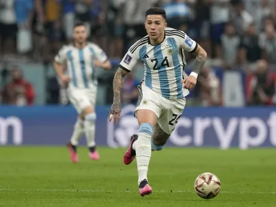 FILE - Argentina's Enzo Fernandez runs with the ball during the World Cup semifinal soccer match between Argentina and Croatia at the Lusail Stadium in Lusail, Qatar, on Dec. 13, 2022. Argentina midfielder Enzo Fernandez became the most expensive player in British soccer history after joining Chelsea from Benfica for 106.7 million pounds (1.4 million), the Portuguese club announced Wednesday, Feb. 1, 2023. (AP Photo/Frank Augstein, File)