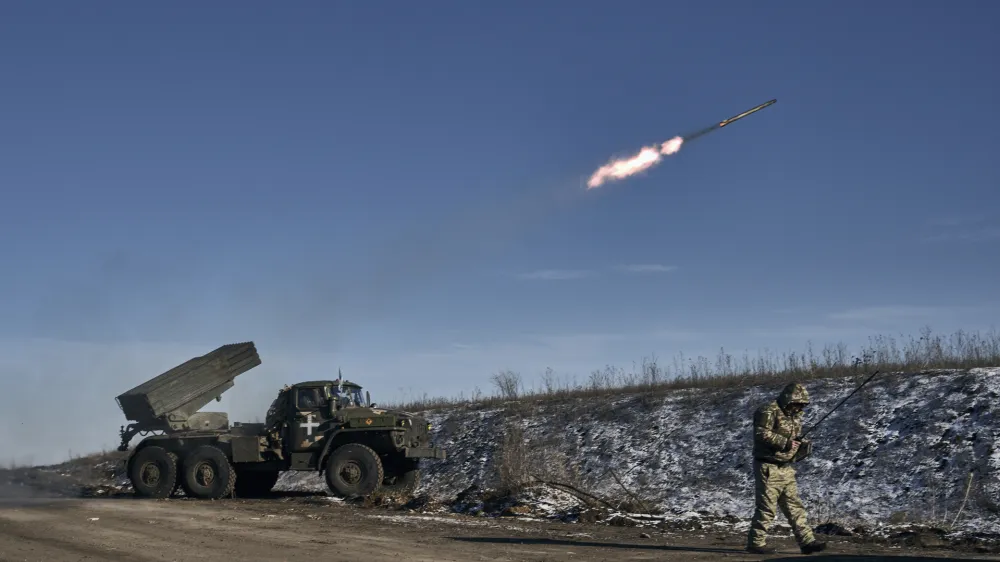 Ukrainian army Grad multiple rocket launcher fires rockets at Russian positions in the frontline near Soledar, Donetsk region, Ukraine, Wednesday, Jan. 11, 2023. (AP Photo/Libkos)