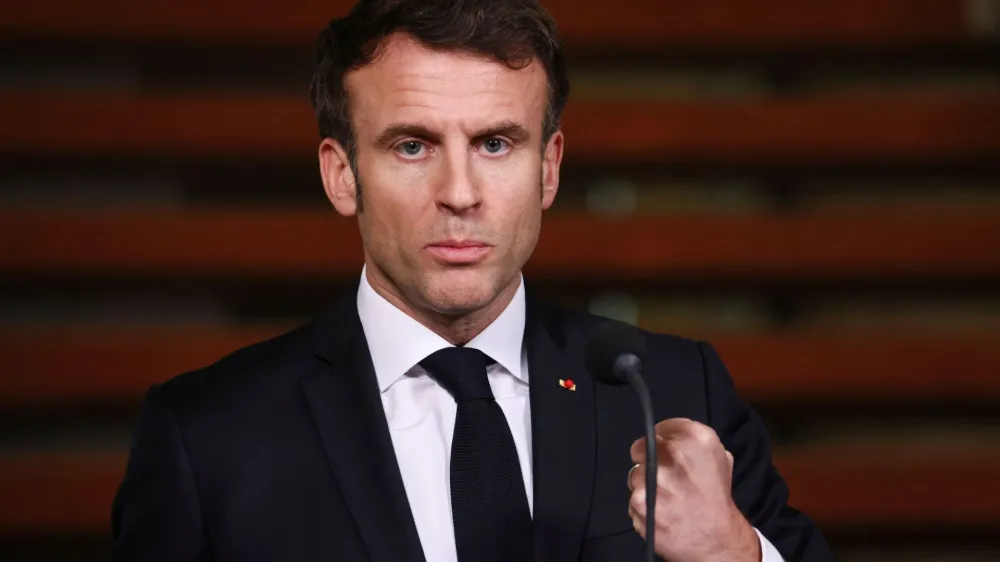 French President Emmanuel Macron reacts, at a joint news conference held with Dutch Prime Minister Mark Rutte, in The Hague, Netherlands January 30, 2023. REUTERS/Yves Herman