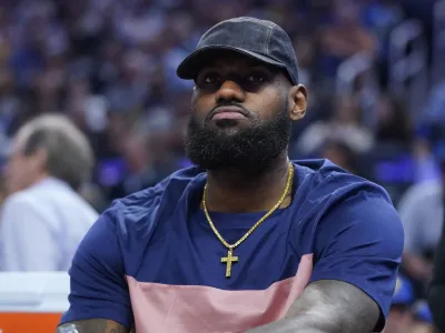 Los Angeles Lakers' LeBron James sits on the bench during the first half of the team's NBA basketball game against the Golden State Warriors in San Francisco, Thursday, April 7, 2022. (AP Photo/Jeff Chiu)