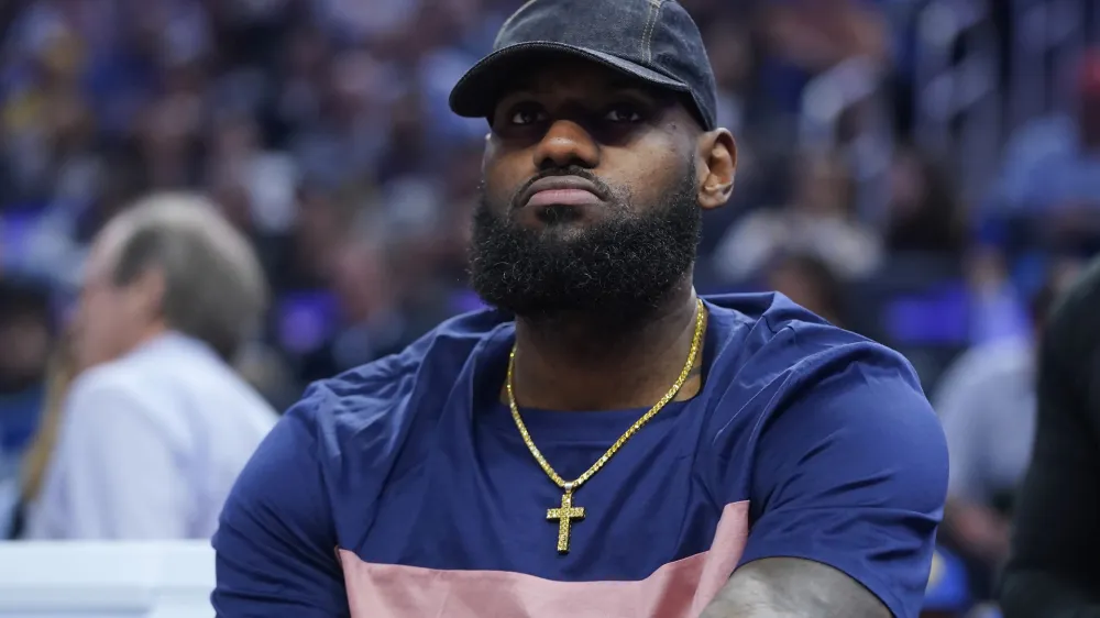 Los Angeles Lakers' LeBron James sits on the bench during the first half of the team's NBA basketball game against the Golden State Warriors in San Francisco, Thursday, April 7, 2022. (AP Photo/Jeff Chiu)