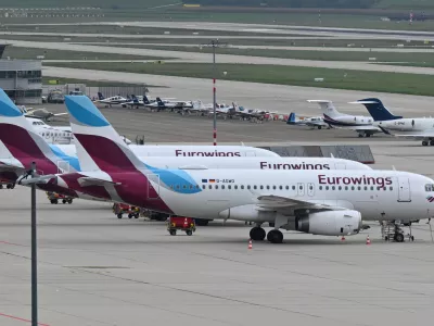 FILED - 06 October 2022, Stuttgart: Aircraft's of Eurowings airline are seen parked on the apron of the airport in Stuttgart. Photo: Bernd Weißbrod/dpa