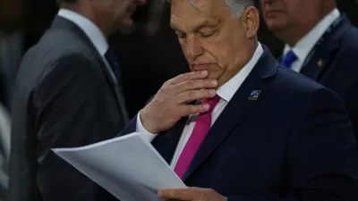 FILE PHOTO: Hungary's Prime Minister Viktor Orban reads a document during NATO's 75th anniversary summit, in Washington, U.S., July 11, 2024. REUTERS/Leah Millis/File Photo