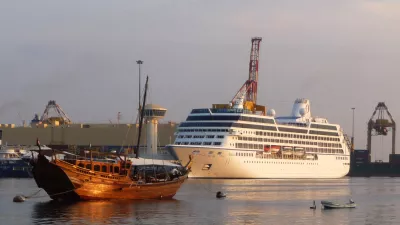 The 600-foot long M/S Nautica, right, prepares for a daylong port stop in the Omani capital of Muscat Wednesday, Dec. 3, 2008. Passengers on a luxury cruise liner attacked by pirates in the dangerous waters between Yemen and Somalia said Wednesday they were surprised by the assailants' boldness and described hearing the "pop, pop, pop" of the pirates' rifles firing at the ship. Sunday's attack on the M/S Nautica in the Gulf of Aden was the latest evidence that pirates have grown more aggressive, viewing almost any ship on the water as a potential target. (AP Photo/ Sebastian Abbot)