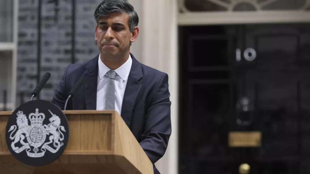 Britain's outgoing Conservative Party Prime Minister Rishi Sunak looks down as he makes a short speech outside 10 Downing Street before going to see King Charles III to tender his resignation in London, Friday, July 5, 2024. Sunak and his Conservative Party lost the general election held July 4, to the Labour Party, whose leader Keir Starmer is set become Prime Minister later Friday. (AP Photo/Kin Cheung)