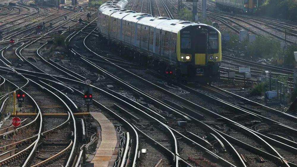 Trains travel towards Clapham Junction railway station, on the day of the State Opening of Parliament in London, Britain, July 17, 2024. REUTERS/Toby Melville