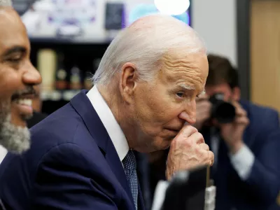 U.S. President Joe Biden rubs his nose while greeting shoppers inside Mario's Westside Market grocery store in Las Vegas, Nevada, U.S., July 16, 2024. REUTERS/Tom Brenner