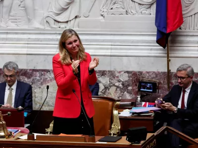 Yael Braun-Pivet, newly elected President of the National Assembly, applauds other candidates after her re-election and results in the third round of votes during the first session after the French parliamentary elections, at the National Assembly in Paris, France, July 18, 2024. REUTERS/Gonzalo Fuentes