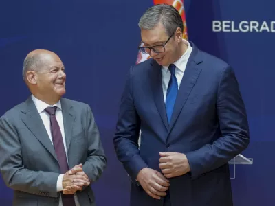 German Chancellor Olaf Scholz, left, and Serbian President Aleksandar Vucic leave after a press conference at the Serbia Palace in Belgrade, Serbia, Friday, July 19, 2024. Scholz visits Serbia to discuss a tentative deal with the Balkan country for the controversial excavation of lithium, a critical substance in making batteries for electric vehicles. (AP Photo/Darko Vojinovic)