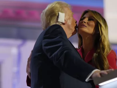 Republican presidential candidate former President Donald Trump, greets his wife, Melania Trump on stage during the Republican National Convention, Thursday, July 18, 2024, in Milwaukee. (AP Photo/Julia Nikhinson)