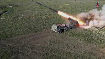 In this photo taken from video released by the Russian Defense Ministry on Friday, July 19, 2024, a Russian self-propelled multiple rocket launcher Uragan  (Hurricane) fires toward Ukrainian position at an undisclosed location in Ukraine. (Russian Defense Ministry Press Service via AP)