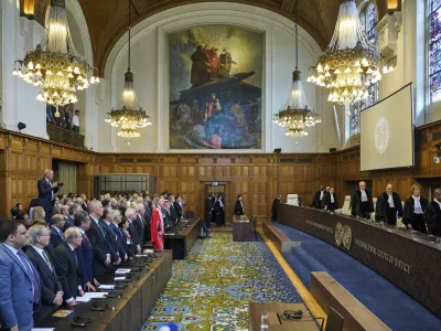 The Judges enter the International Court of Justice, or World Court, in The Hague, Netherlands, Friday July 19, 2024, where the United Nations top court is delivering a nonbinding advisory opinion Friday on the legality of Israel's 57-year occupation of lands sought for a Palestinian state, a ruling that could have more effect on international opinion than it will on Israeli policies. (AP Photo/Phil Nijhuis)