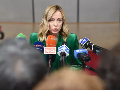 FILED - 15 December 2023, Belgium, Brussels: Italian Prime Minister Giorgia Meloni speaks to media upon her arrival to attend the second day of the EU Summit. Meloni has accused a German search-and-rescue organization of ignoring the role of human traffickers in the deaths of thousands in response to accusations she was working on a "dystopian migration policy" with Libya. Photo: Gaetan Claessens/EU COUNCIL/dpa - ATTENTION: editorial use only and only if the credit mentioned above is referenced in full