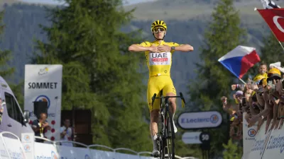 Slovenia's Tadej Pogacar, wearing the overall leader's yellow jersey, crosses the finish line to take his fifth stage win during the twentieth stage of the Tour de France cycling race over 132.8 kilometers (82.5 miles) with start in Nice and finish in La Couillole pass, France, Saturday, July 20, 2024. (AP Photo/Jerome Delay)