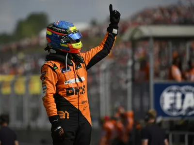 McLaren driver Oscar Piastri of Australia celebrates after winning the Hungarian Formula One Grand Prix race at the Hungaroring racetrack in Mogyorod, Hungary, Sunday, July 21, 2024. (AP Photo/Denes Erdos)