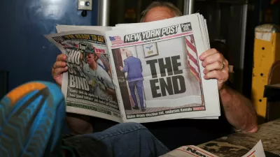 A person reads a copy of the New York Post while taking a break the day U.S. President Joe Biden announced that he is dropping his reelection bid, at the New York Times College Point Printing Plant in Queens, New York City, New York, U.S., July 21, 2024. REUTERS/Caitlin Ochs