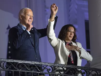 President Joe Biden raises the hand of Vice President Kamala Harris after viewing the Independence Day fireworks display over the National Mall from the balcony of the White House, Thursday, July 4, 2024, in Washington. She's already broken barriers, and now Harris could soon become the first Black woman to head a major party's presidential ticket after President Joe Biden's ended his reelection bid. The 59-year-old Harris was endorsed by Biden on Sunday, July 21, after he stepped aside amid widespread concerns about the viability of his candidacy. (AP Photo/Evan Vucci)