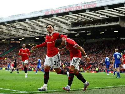 Soccer Football - Premier League - Manchester United v Leicester City - Old Trafford, Manchester, Britain - February 19, 2023 Manchester United's Jadon Sancho celebrates scoring their third goal with Bruno Fernandes REUTERS/Molly Darlington EDITORIAL USE ONLY. No use with unauthorized audio, video, data, fixture lists, club/league logos or 'live' services. Online in-match use limited to 75 images, no video emulation. No use in betting, games or single club /league/player publications. Please contact your account representative for further details.   TPX IMAGES OF THE DAY