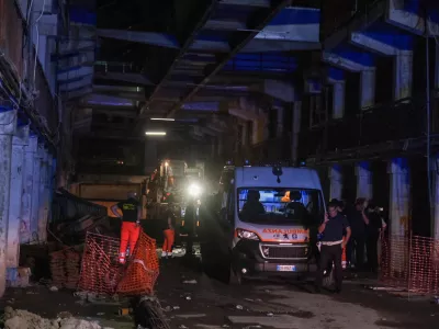 An ambulance is seen at the site of a collapsed balcony in Naples, Italy July 22, 2024. REUTERS/Antonio Balasco