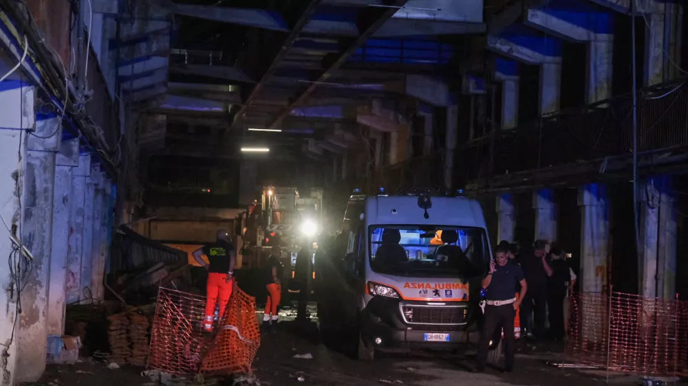 An ambulance is seen at the site of a collapsed balcony in Naples, Italy July 22, 2024. REUTERS/Antonio Balasco