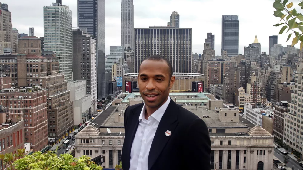 French soccer star Thierry Henry gets a rooftop view of New York after an interview, Thursday, July 15, 2010. Henry is retiring from the French national team. The 32-year-old forward announced his decision during an interview Thursday at the offices of The Associated Press before a news conference to discuss his signing with Major League Soccer's New York Red Bulls.