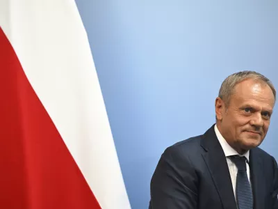 FILE - Poland's Prime Minister Donald Tusk reacts during a bilateral meeting with Britain's Prime Minister Keir Starmer, at the European Political Community meeting, at Blenheim Palace in Woodstock, southern England, Thursday, July 18, 2024. U.S. President Joe Biden's withdrawal from the U.S. presidential race injects greater uncertainty into the world. (Justin Tallis/Pool Photo via AP, File)