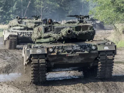 Handout photos of the Polish Defense Ministry shows Leopard 2A4 tanks at the military rest range in Zagan, Poland, Sept.15, 2013. (Polish Defense Ministry via AP)