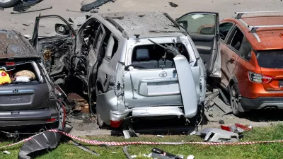 A view shows damaged cars, including a Toyota Land Cruiser, following an explosion caused by the detonation of an unidentified device, which reportedly injured an officer from Russia's military intelligence agency, in the courtyard of a residential building in Moscow, Russia July 24, 2024. REUTERS/Shamil Zhumatov