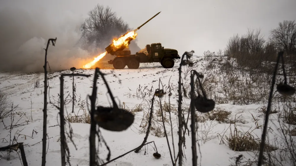 FILE - Ukrainian servicemen of the Prince Roman the Great 14th Separate Mechanized Brigade fire a Soviet era Grad multiple rocket launcher at Russian positions in the Kharkiv area, Ukraine, Saturday, Feb. 25, 2023. Grueling artillery battles have stepped up in recent weeks in the vicinity of Kupiansk, a strategic town on the eastern edge of Kharkiv province by the banks of the Oskil River as Russian attacks intensifying in a push to capture the entire industrial heartland known as the Donbas, which includes the Donetsk and the Luhansk provinces. (AP Photo/Vadim Ghirda, File)